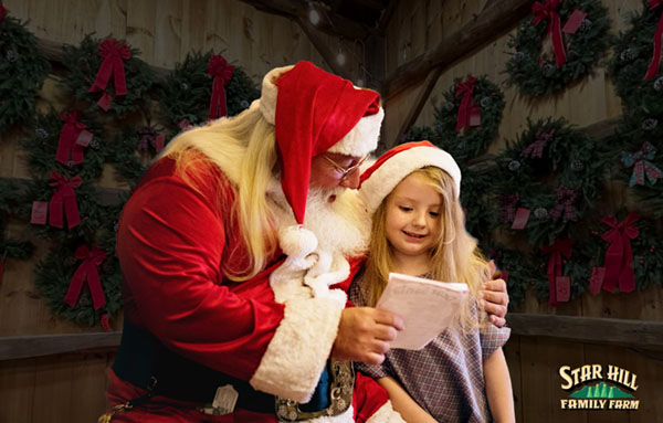 Photo of child with Santa at Star Hill Family Farm